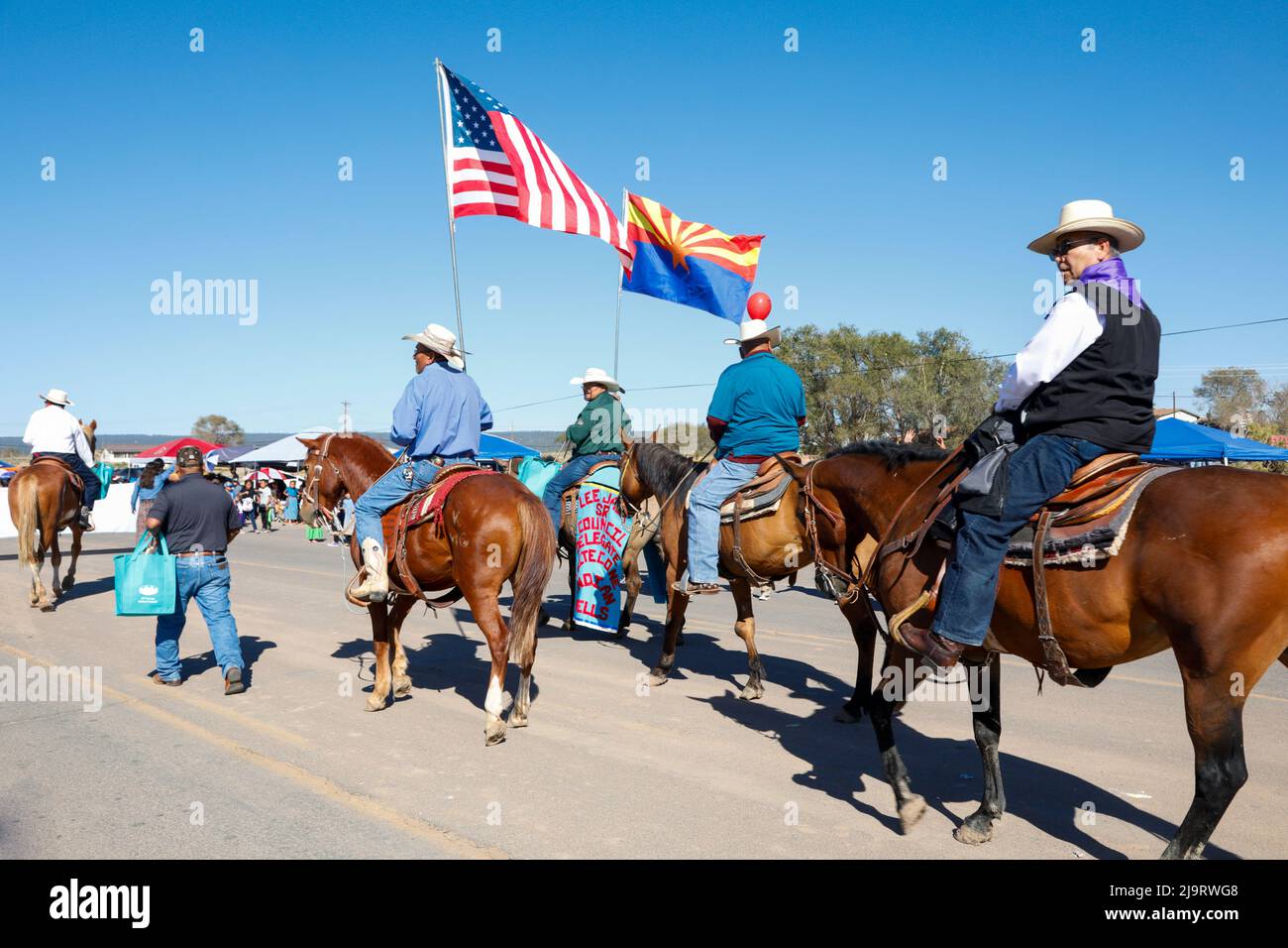Window Rock, Arizona, USA. Navajo Nation Fair. Men riding horses in