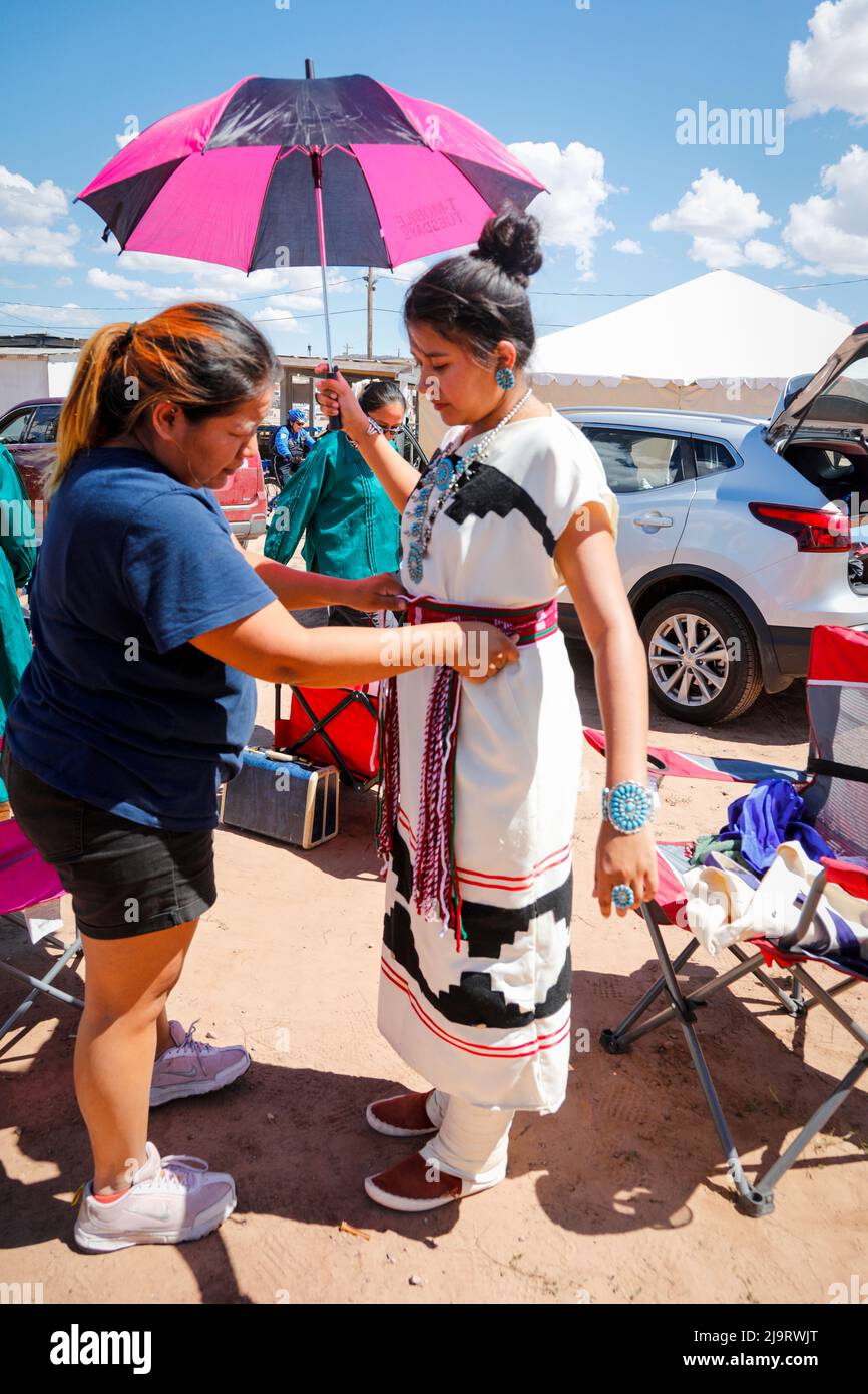 Window Rock, Arizona, USA. Navajo Nation Fair. Woman putting on