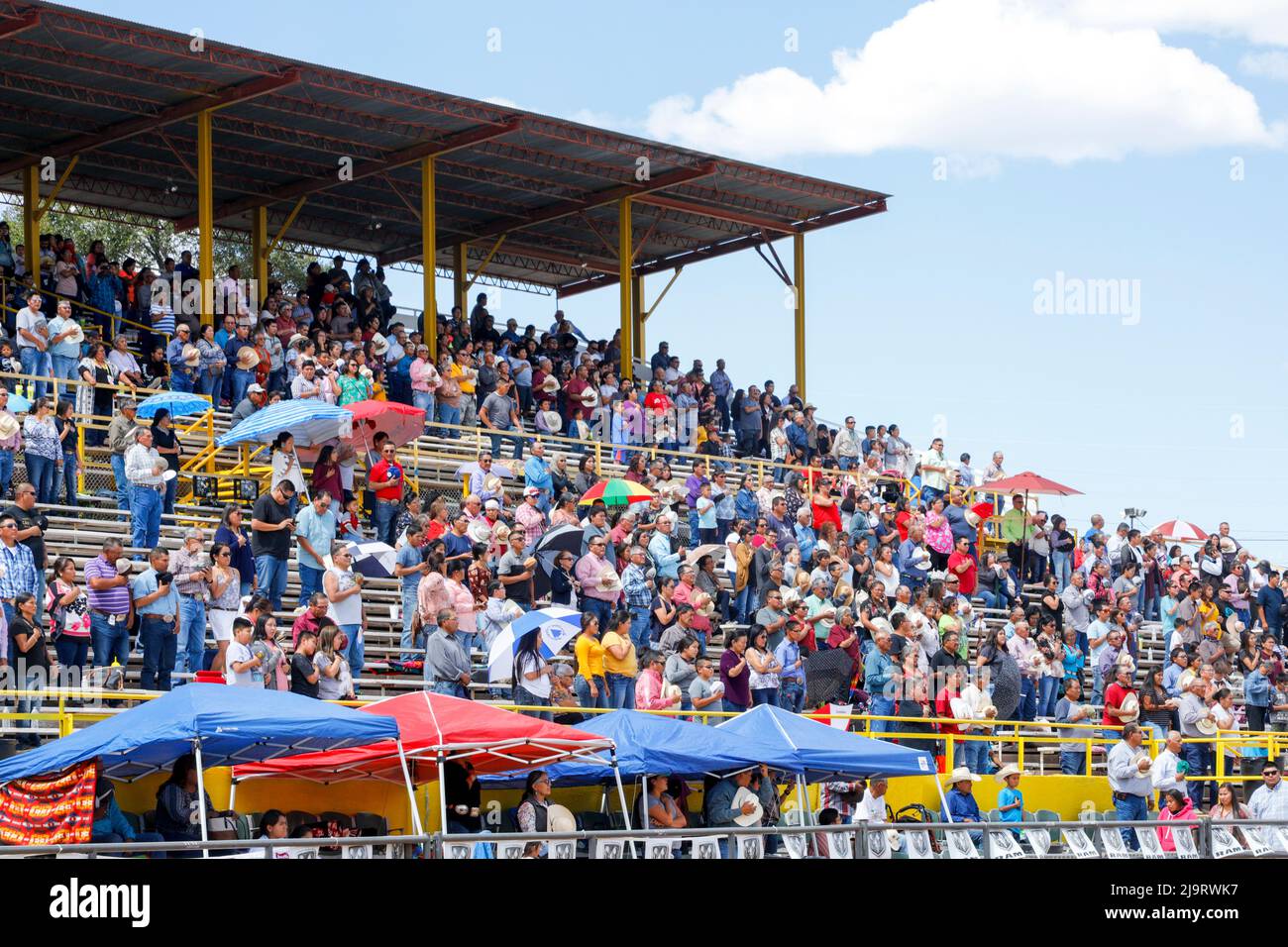 Window Rock, Arizona, USA. Navajo Nation Fair. Crowd in the stands, standing during National Anthem. (Editorial Use Only) Stock Photo