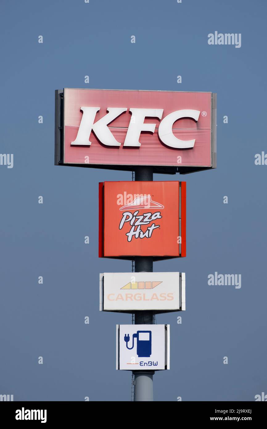 Sign and Logo of  KFC, Pizza Hut, Carglass und Enbw Stock Photo