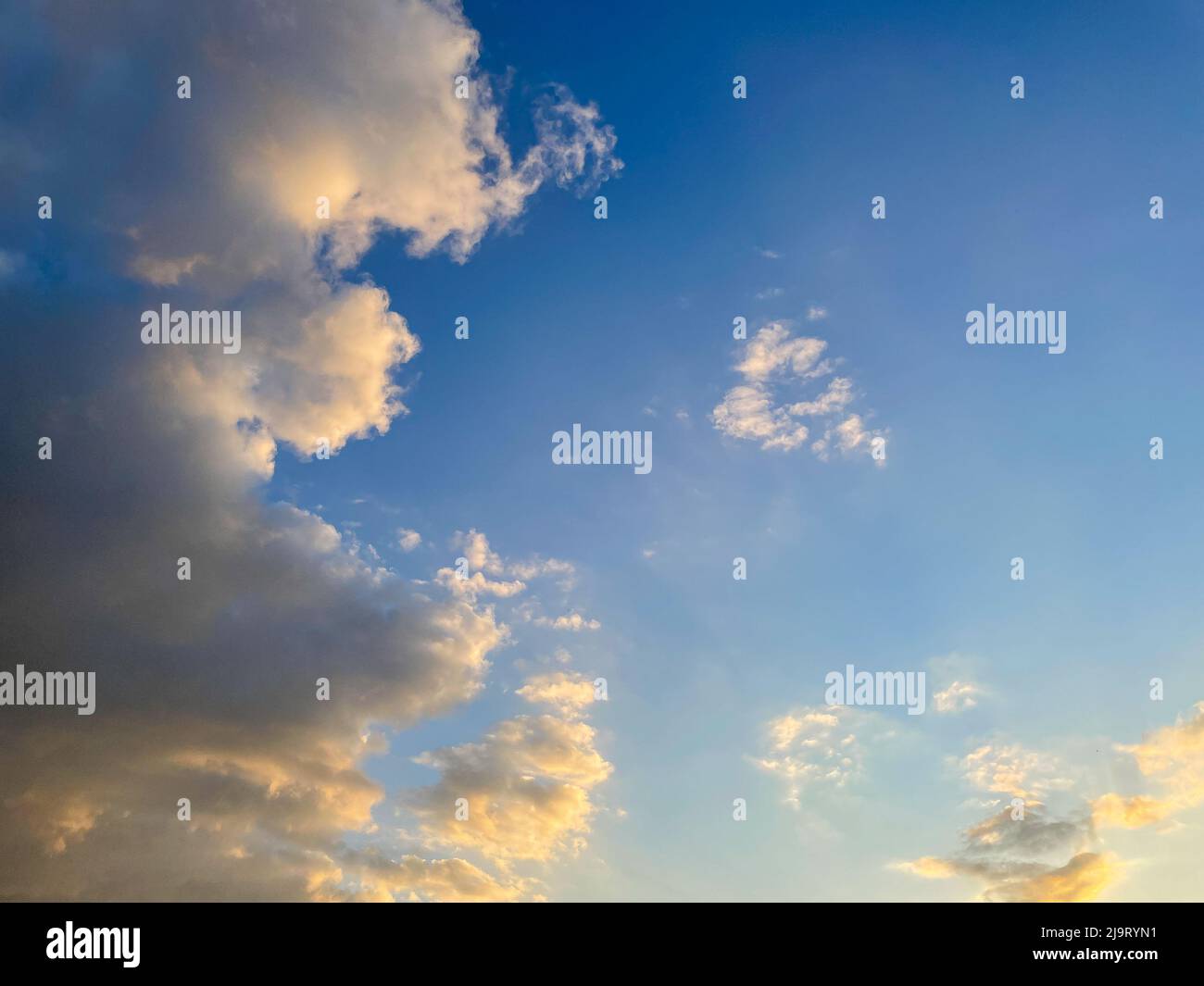 Sunset sky with fluffy clouds, morning or down time of day Stock Photo ...