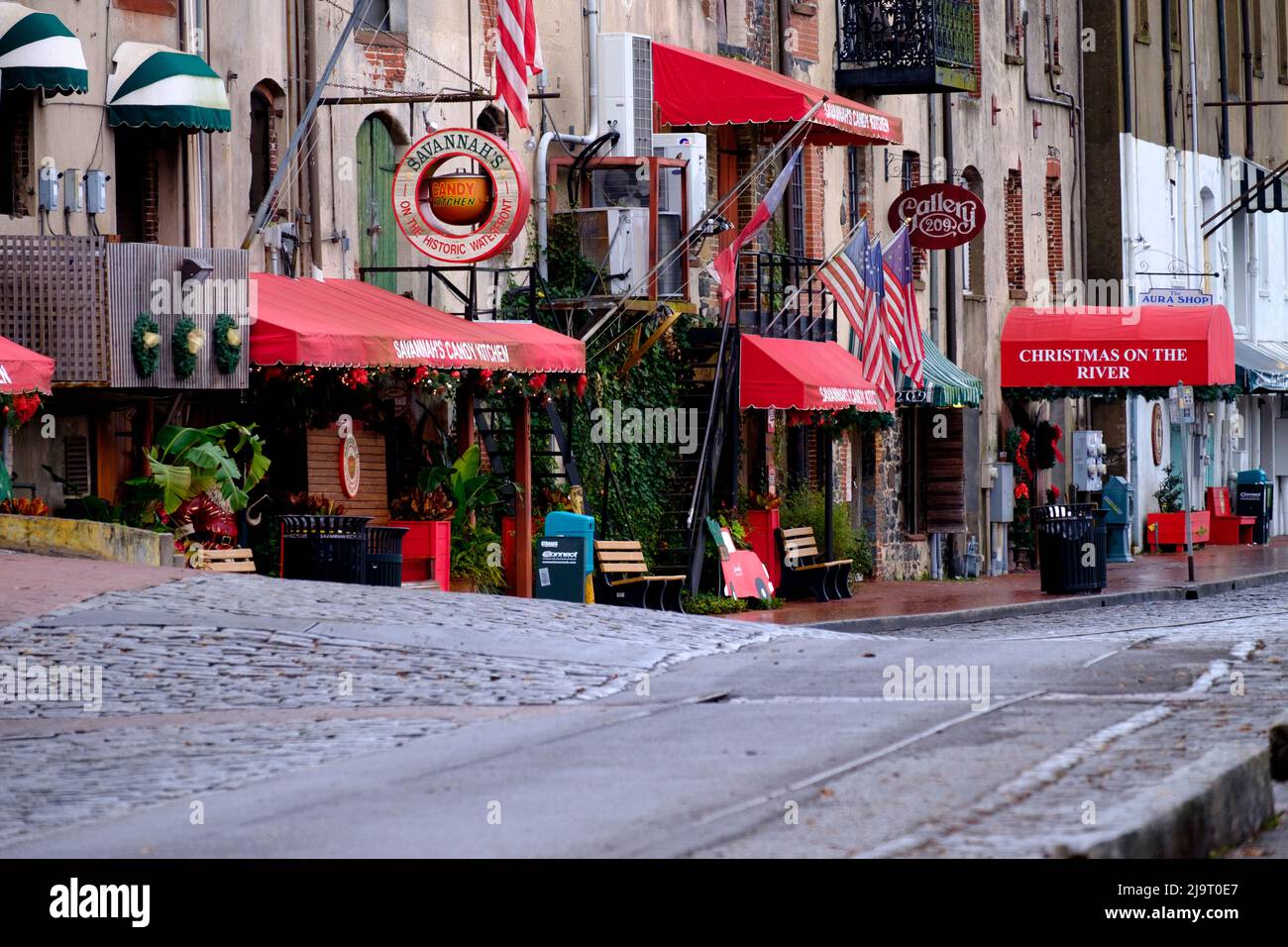 USA, Savannah. Stores and old railroad tracks along Historic River Street (Editorial
