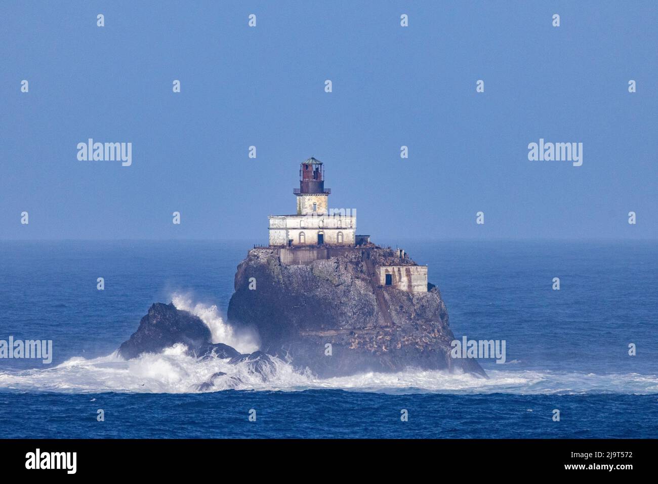 Waves crash on Tillamook Rock Lighthouse at Ecola State Park in Cannon Beach, Oregon, USA Stock