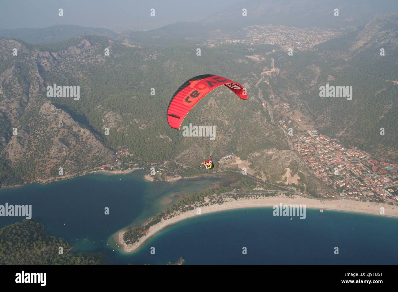Paragliding over Oludeniz, Turkey. Stock Photo