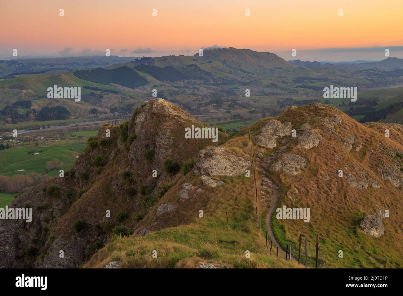 View from the summit of Te Mata Peak, a mountain in the Hawke's Bay region of New Zealand, at sunset, looking down at the Tukituki River Stock Photo