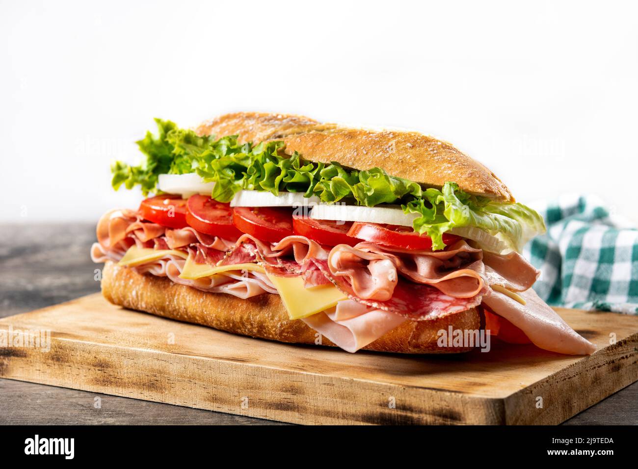 Submarine sandwich with ham, cheese, lettuce, tomatoes,onion