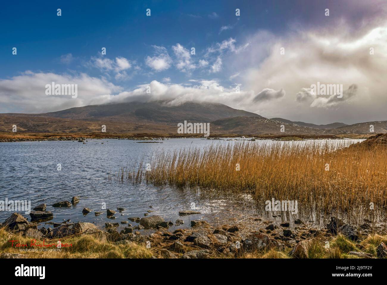 Ben More from Loch Cann a'Bhaigh on South Uist in the Outer Hebrides of Scotland Stock Photo