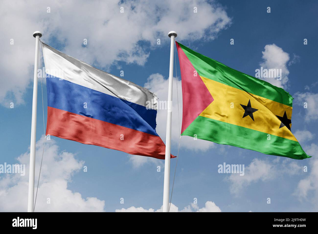 Russia and Sao Tome and Principe two flags on flagpoles and blue cloudy sky background Stock Photo