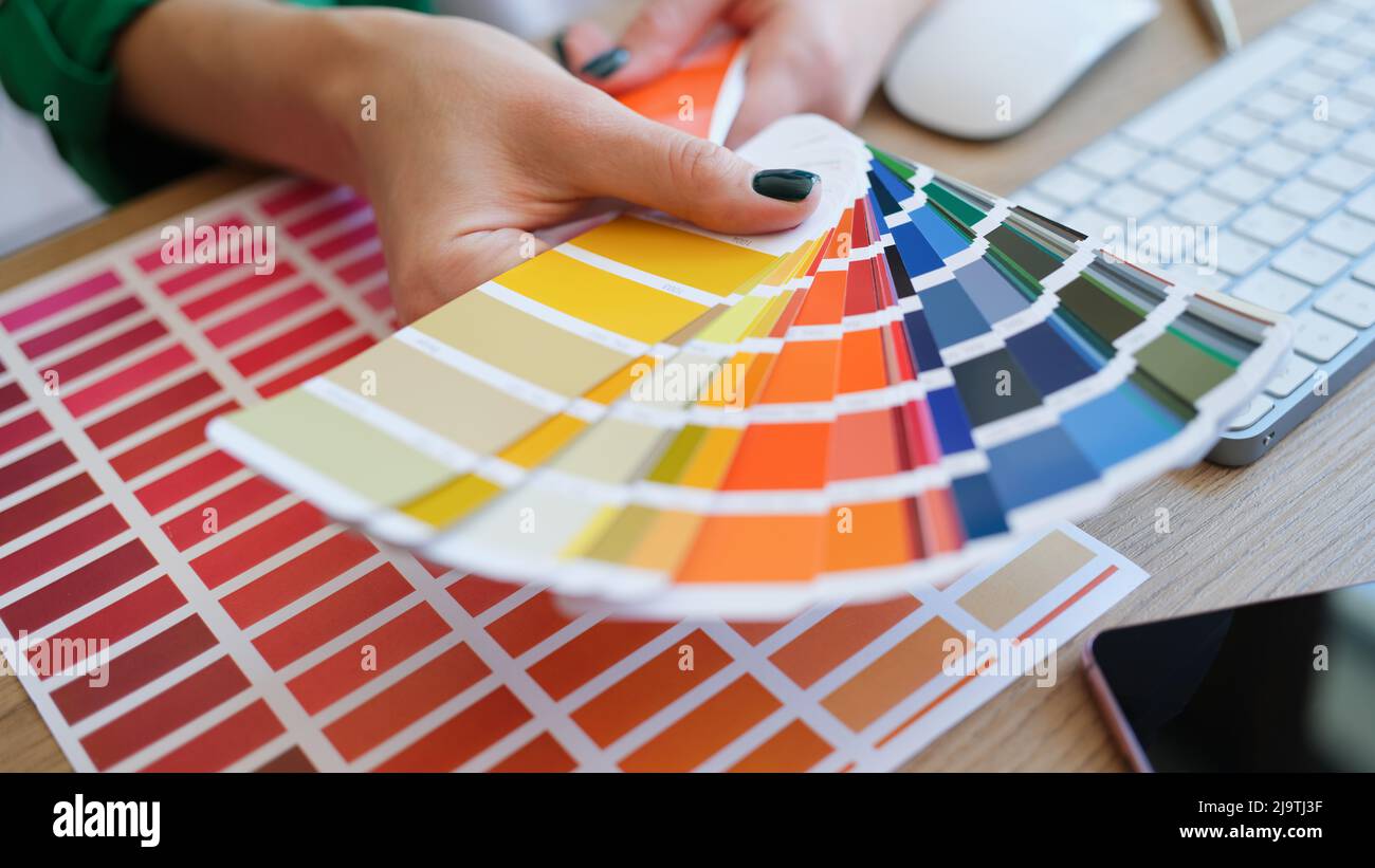 Graphic designer is working on choosing palette colors for creative business Stock Photo