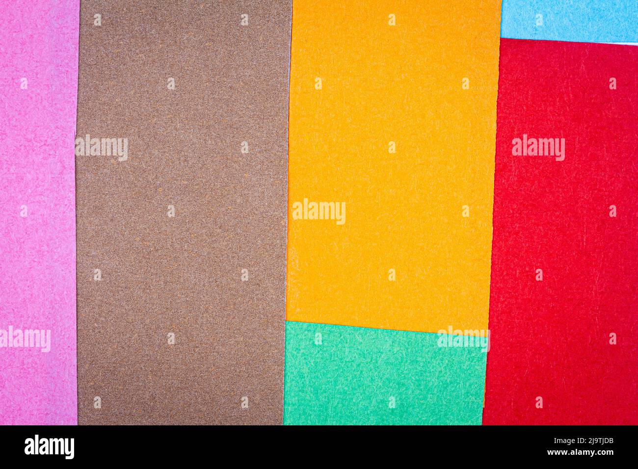 Multicolor background from a paper of different colors. Abstract ...