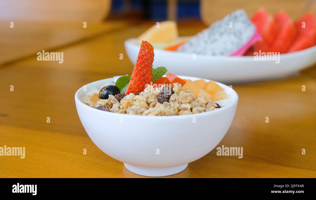 Healthy breakfast food eating, lose weight concept, granola bowl with yogurt Stock Photo