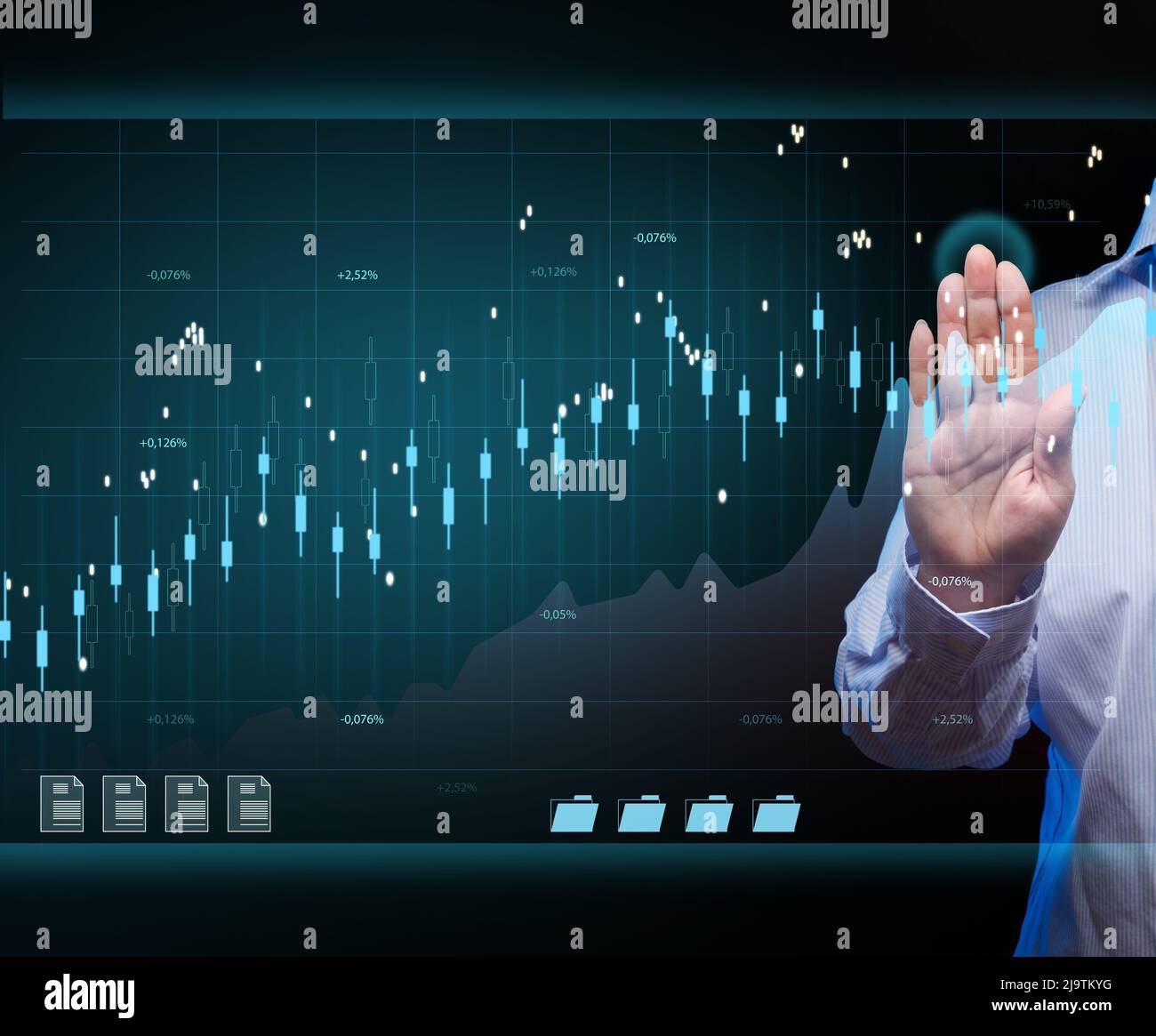 A woman is standing in front of a virtual holographic chart with growing numbers. The concept of successful business, high profits, growth rates Stock Photo