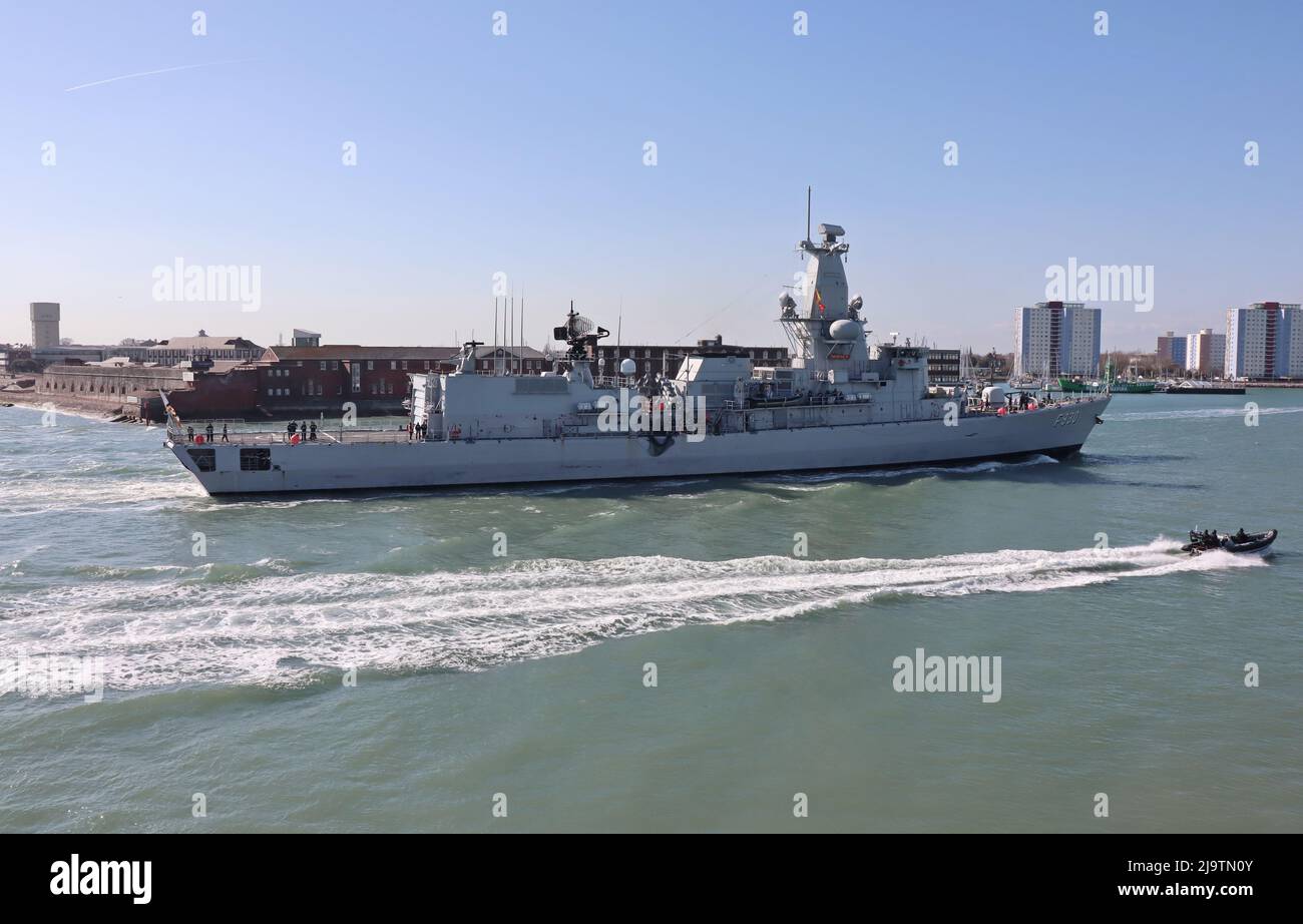 A police patrol boat speeds past the Belgian Navy frigate BNS LEOPOLD 1 as it enters harbour Stock Photo