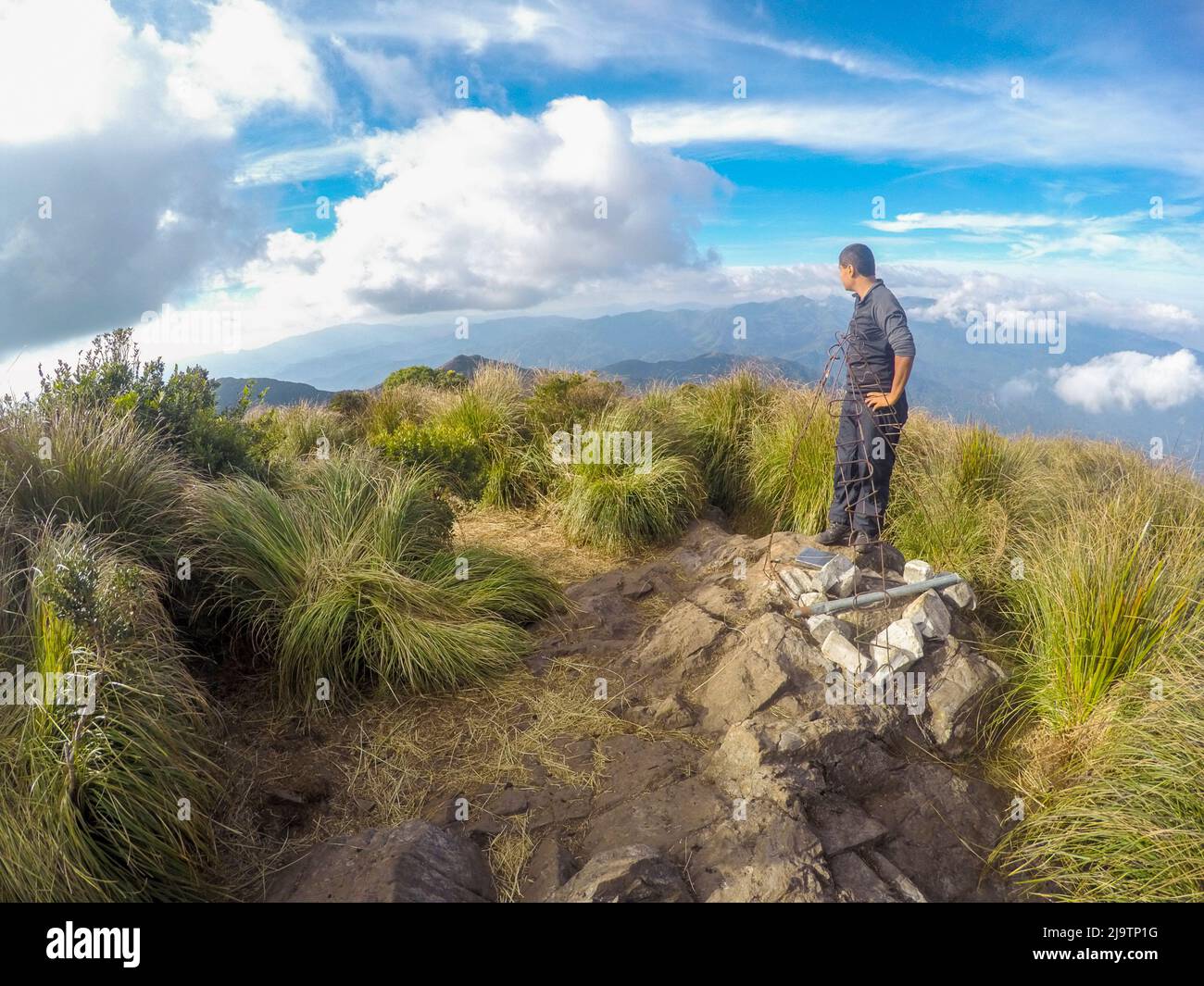 Man high on the Serra Fina crest in the Mantiqueira Mountains in the state of Minas Gerais. Stock Photo