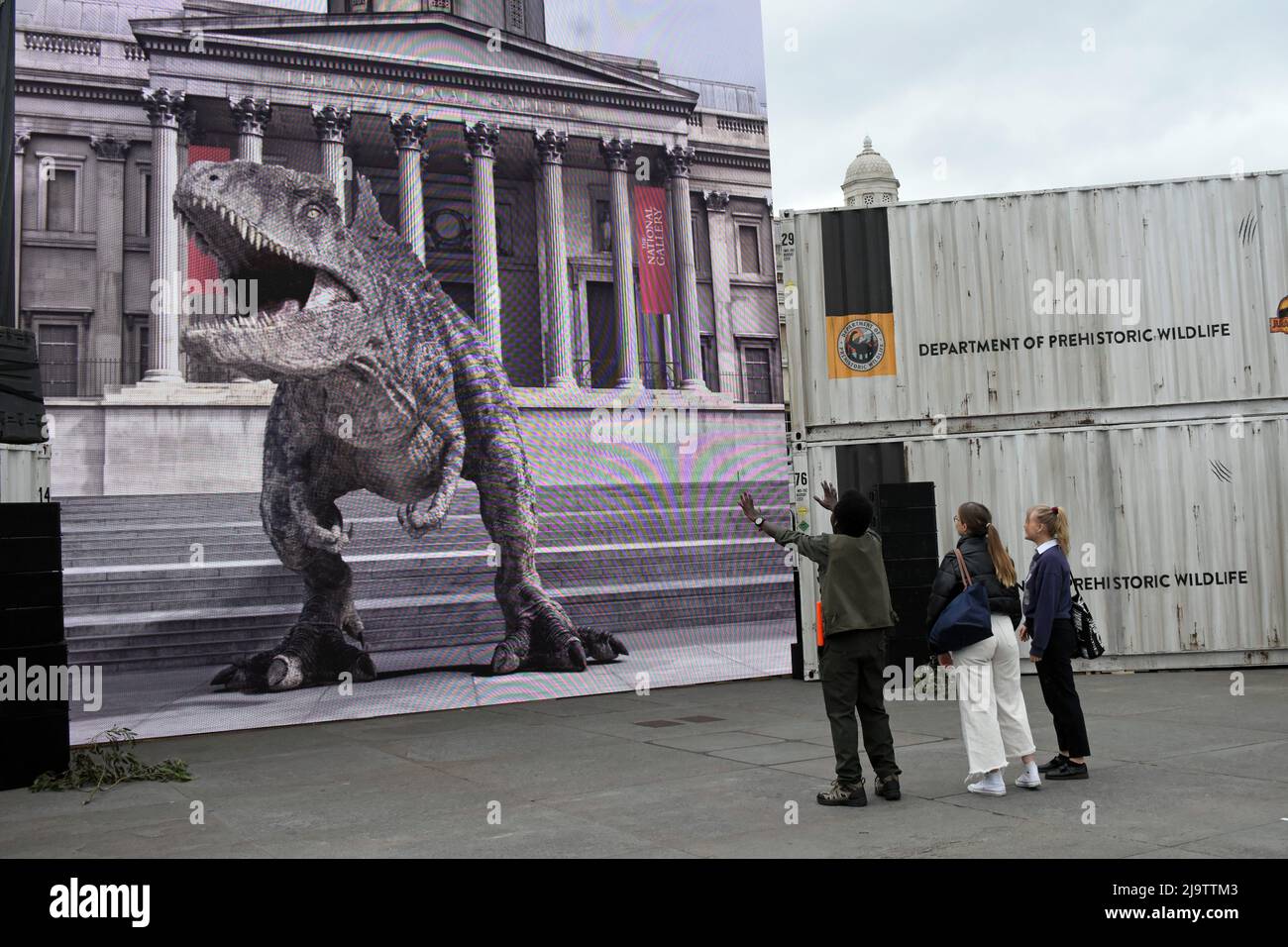 25th May, 2022. London, UK, Jurassic World life size virtual reality dinosaur meets people on Trafalgar Square accompanied by the dinosaur's keeper. The film comes to cinemas on June 10 2022. Credit: JOHNNY ARMSTEAD/Alamy Live NewsTyrannosaurus rex (rex meaning 'king' in Latin), often called T. rex or colloquially T-Rex Stock Photo