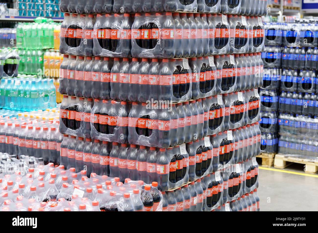 Tyumen, Russia-May 11, 2022: Coca Cola brand soft drink on display for sell at a supermarket. Coca Cola is a famous soft drink maker. Stock Photo