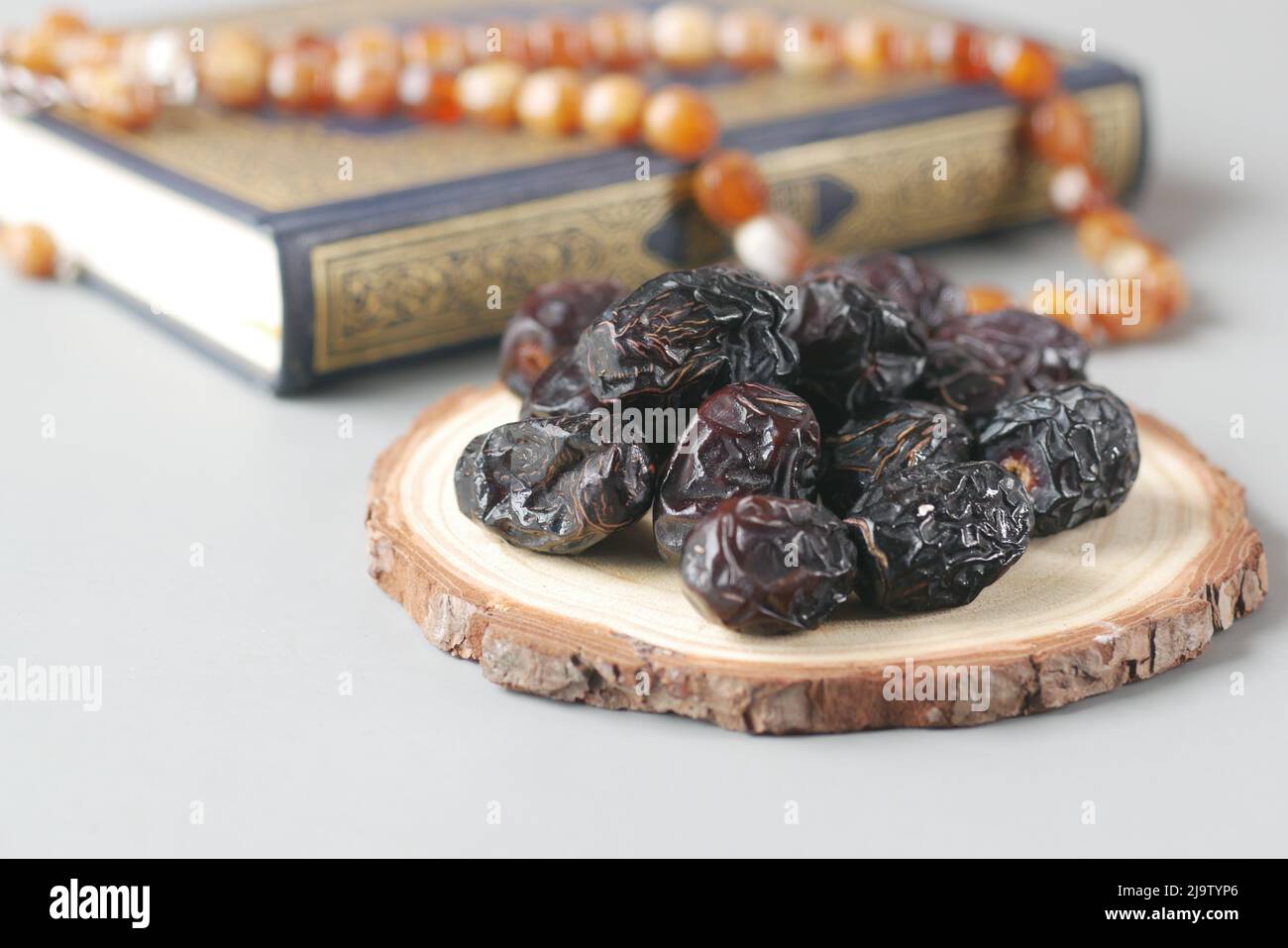 Holy book Quran and rosary on table, close up. Stock Photo