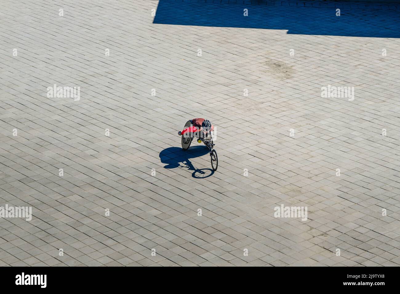 Kazan, Russia - May 17, 2022: woman disabled athlete in wheelchair during Kazan Marathon Stock Photo
