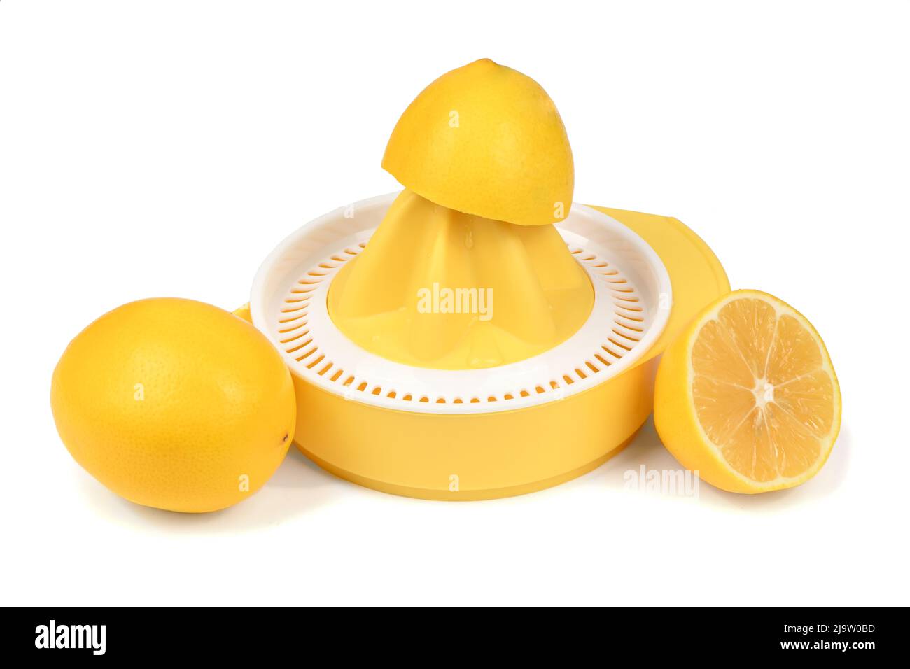 Citrus squeezer with lemons isolated on white. High resolution photo