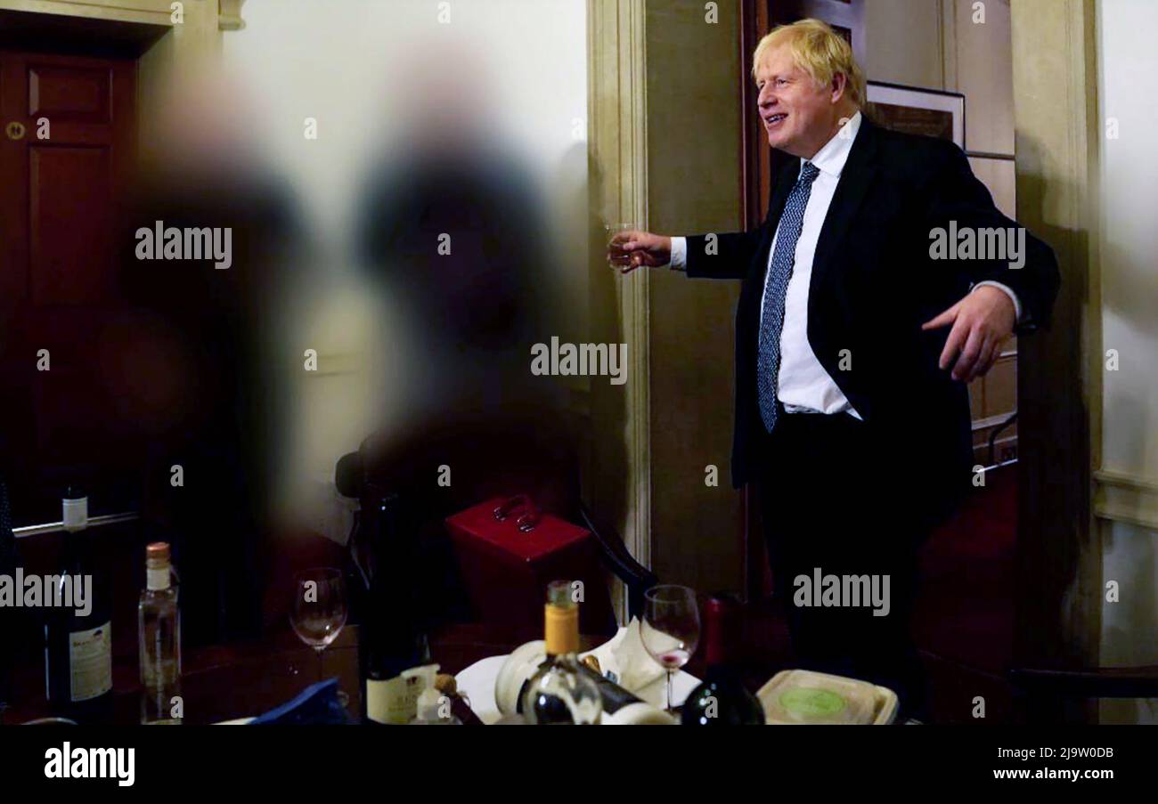 PM pictured drinking at No 10 party during lockdown Photographs released in Sue Gray Report  show the Prime Minister raising a glass at a leaving part Stock Photo
