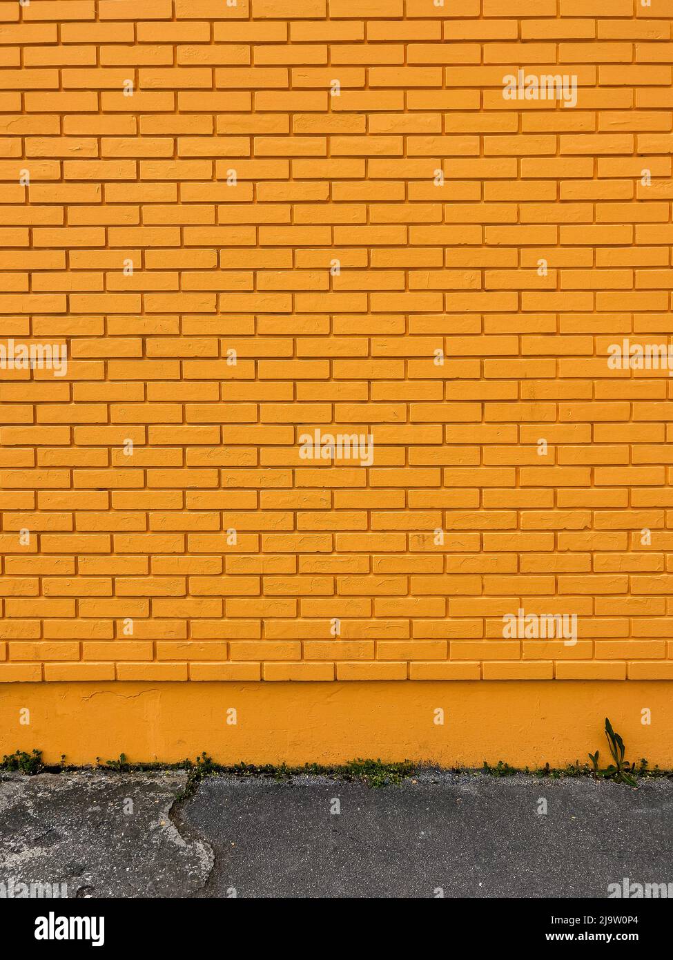 Yellow brick wall texture as background Stock Photo - Alamy