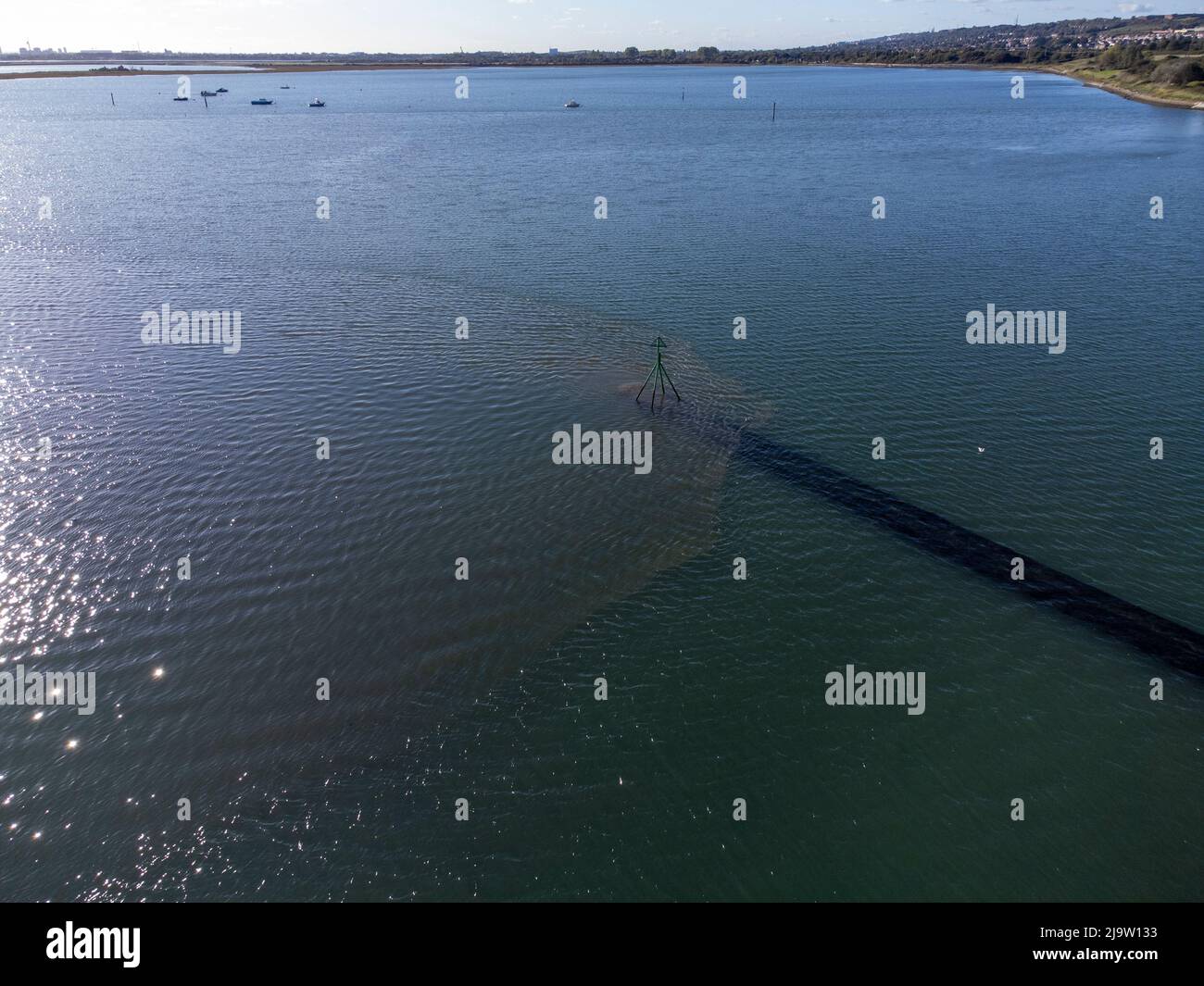 Aerial view of raw sewage being pumped into Langstone Harbour in Hampshire from Budd's farm wastewater treatment plant Stock Photo