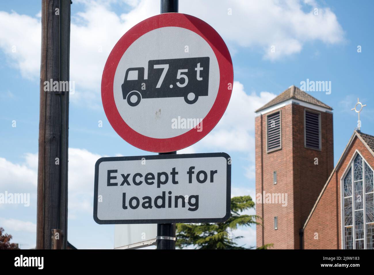 UK road sign with restrictions for vehicle weighing over 7.5 tonnes are not allowed unless for Loading Stock Photo