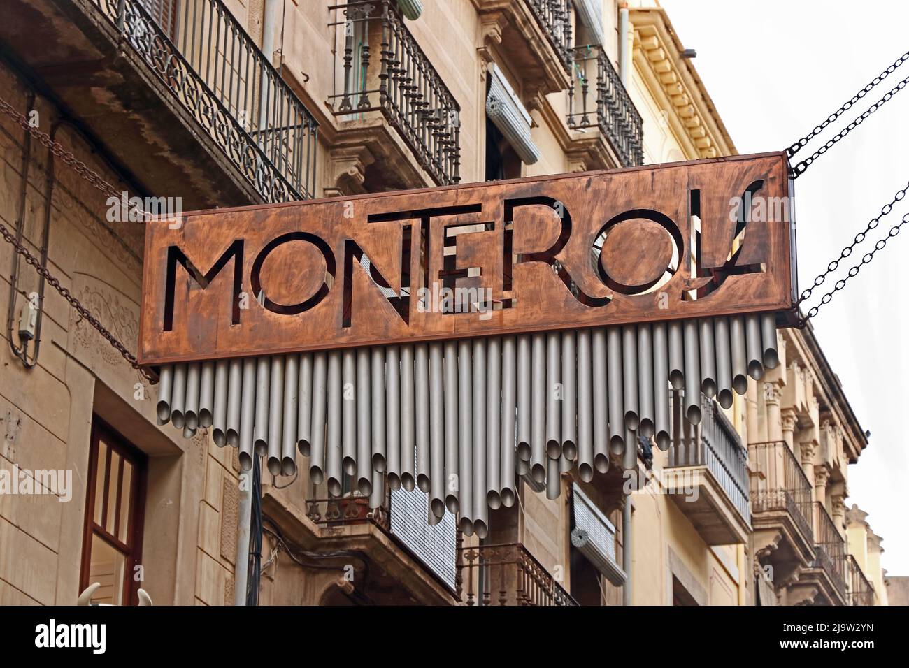 Monterols sign over shopping street, Reus Stock Photo