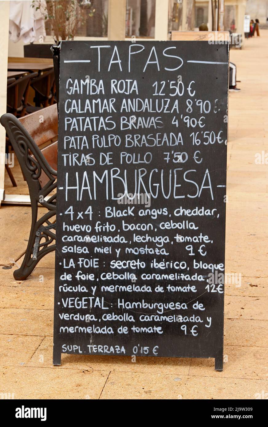 Blackboard advertising Tapas and Hamburgues (burgers) outside restaurant, Tarragona Stock Photo
