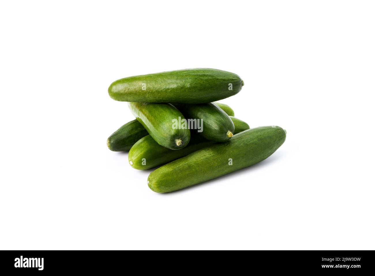Stack tasty mini green cucumbers on a white background. Healthy food Stock Photo