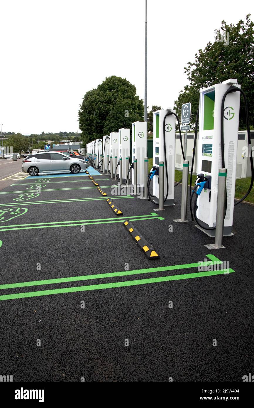 New Gridserve bank of EV charging points Junction 30 on M5 features 12 high-power chargers with a maximum 350kW capacity – enough for the latest elect Stock Photo