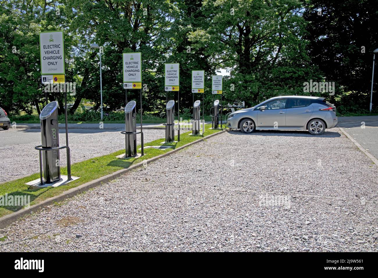 Nissan Leaf electric car charging at the bank of Podpoint chargers at