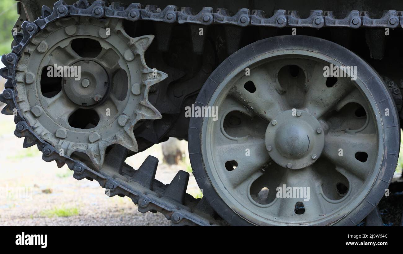 Detail of the front track drive of armored vehicle (sprocket and tread) Stock Photo