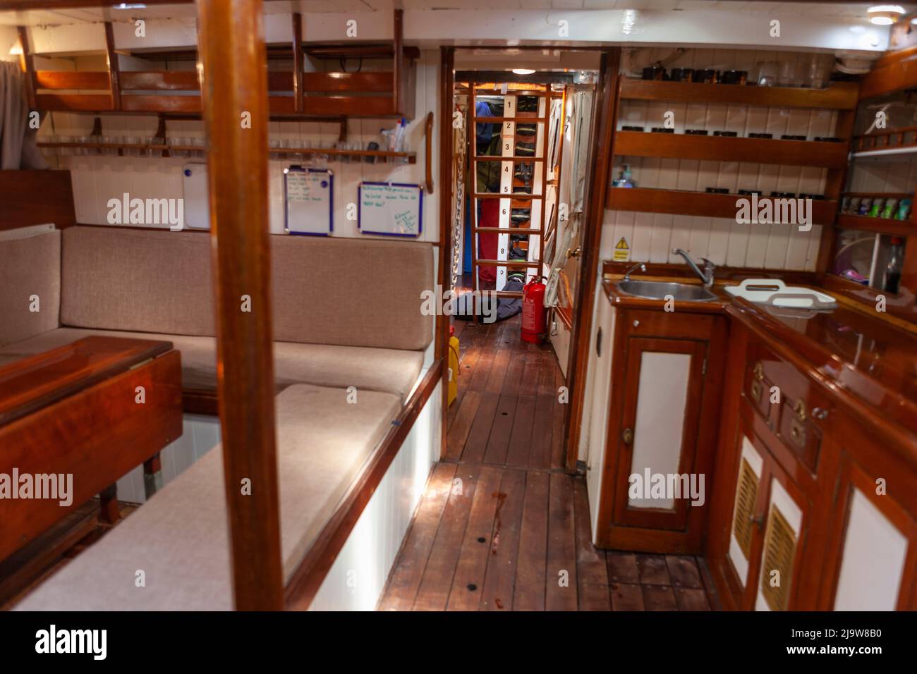 Saloon interior of the famous gaff cutter 'Jolie Brise', River Hamble, Hampshire, UK Stock Photo