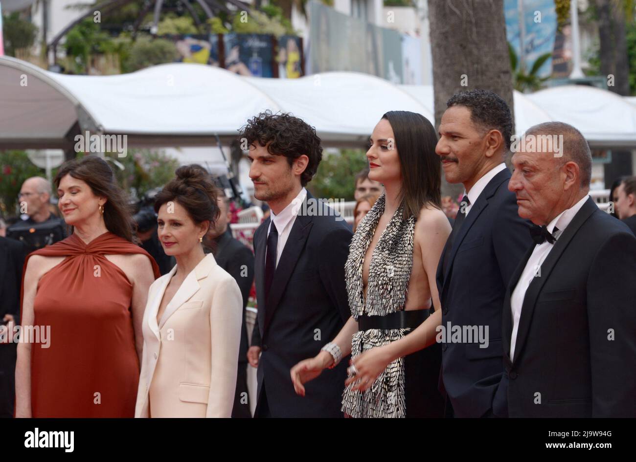 May 24, 2022, CANNES, France: CANNES, FRANCE - MAY 24: (L-R) Producer Anne-Dominique Toussaint, Anouk Grinberg, Director Louis Garrel, Roschdy Zem, NoÃ©mie Merlant and Writer Jean-Claude Pautot attend of the film ''L'Innoncent'' (The Innocent) attend the 75th Anniversary celebration screening of ''The Innocent (L'Innocent)'' during the 75th annual Cannes film festival at Palais des Festivals on May 24, 2022 in Cannes, France. (Credit Image: © Frederick Injimbert/ZUMA Press Wire) Stock Photo