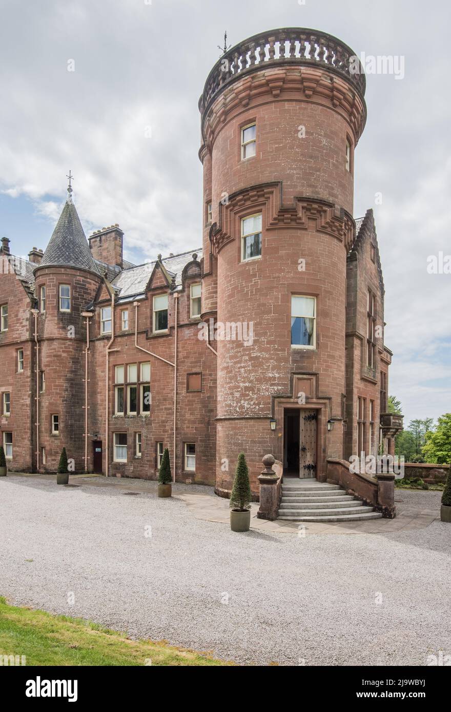 Threave House, a Scottish baronial mansion near Castle Douglas, is built in distinctive red sandstone & is  a National Trust for Scotland property. Stock Photo