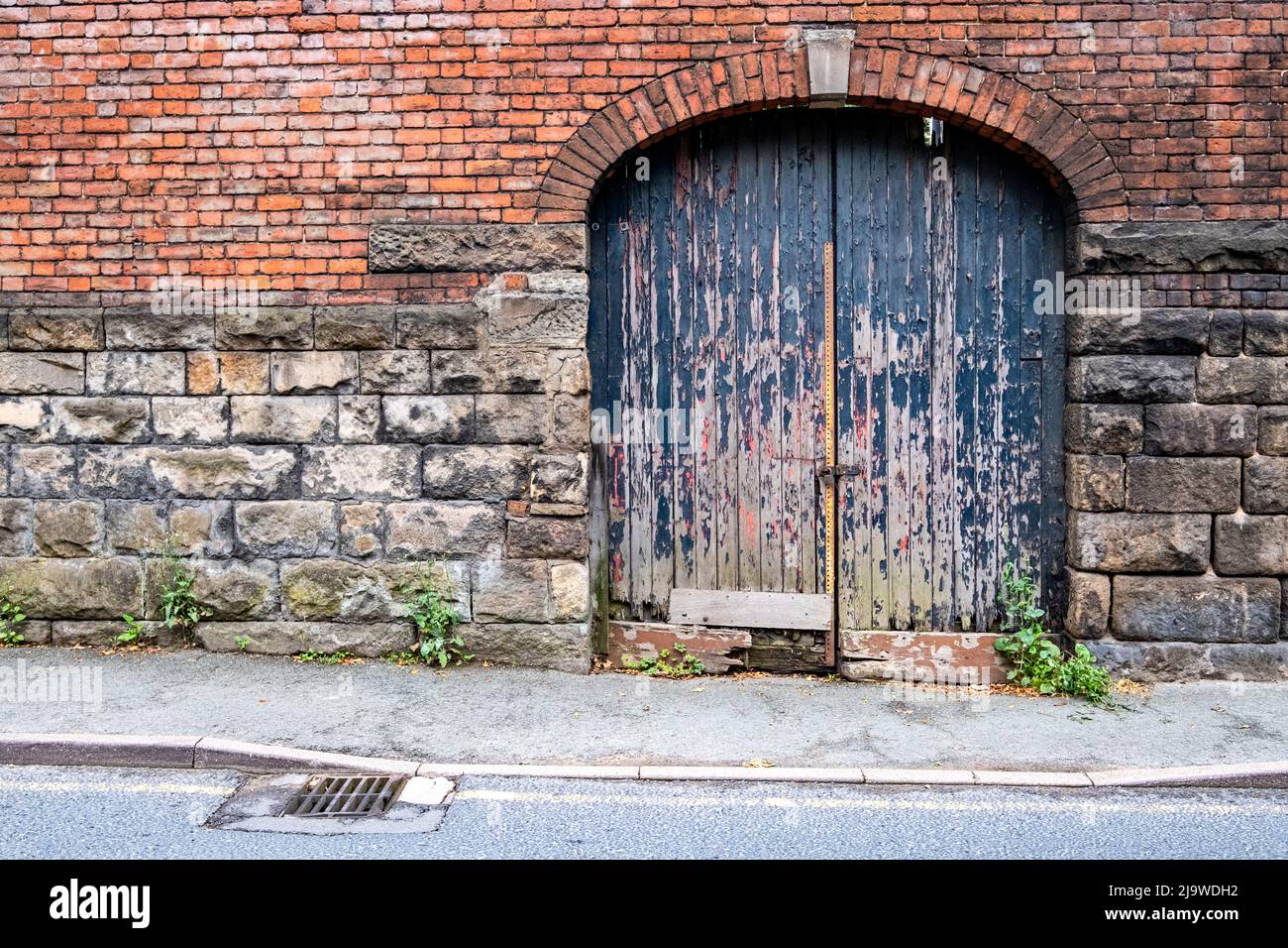 Entrance to old factory or workshop UK Stock Photo