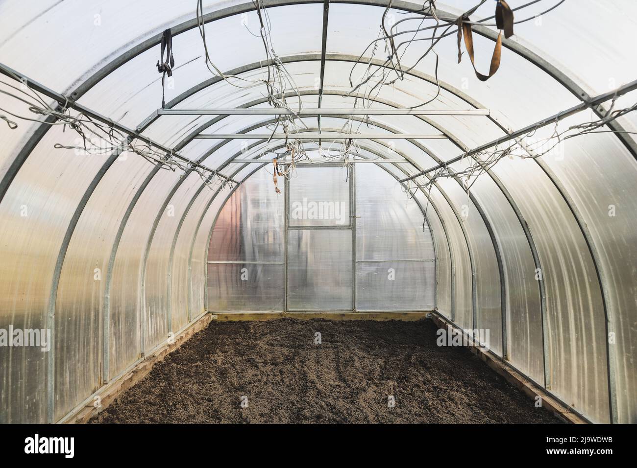 The empty greenhouse before planting. Plowed earth Stock Photo - Alamy