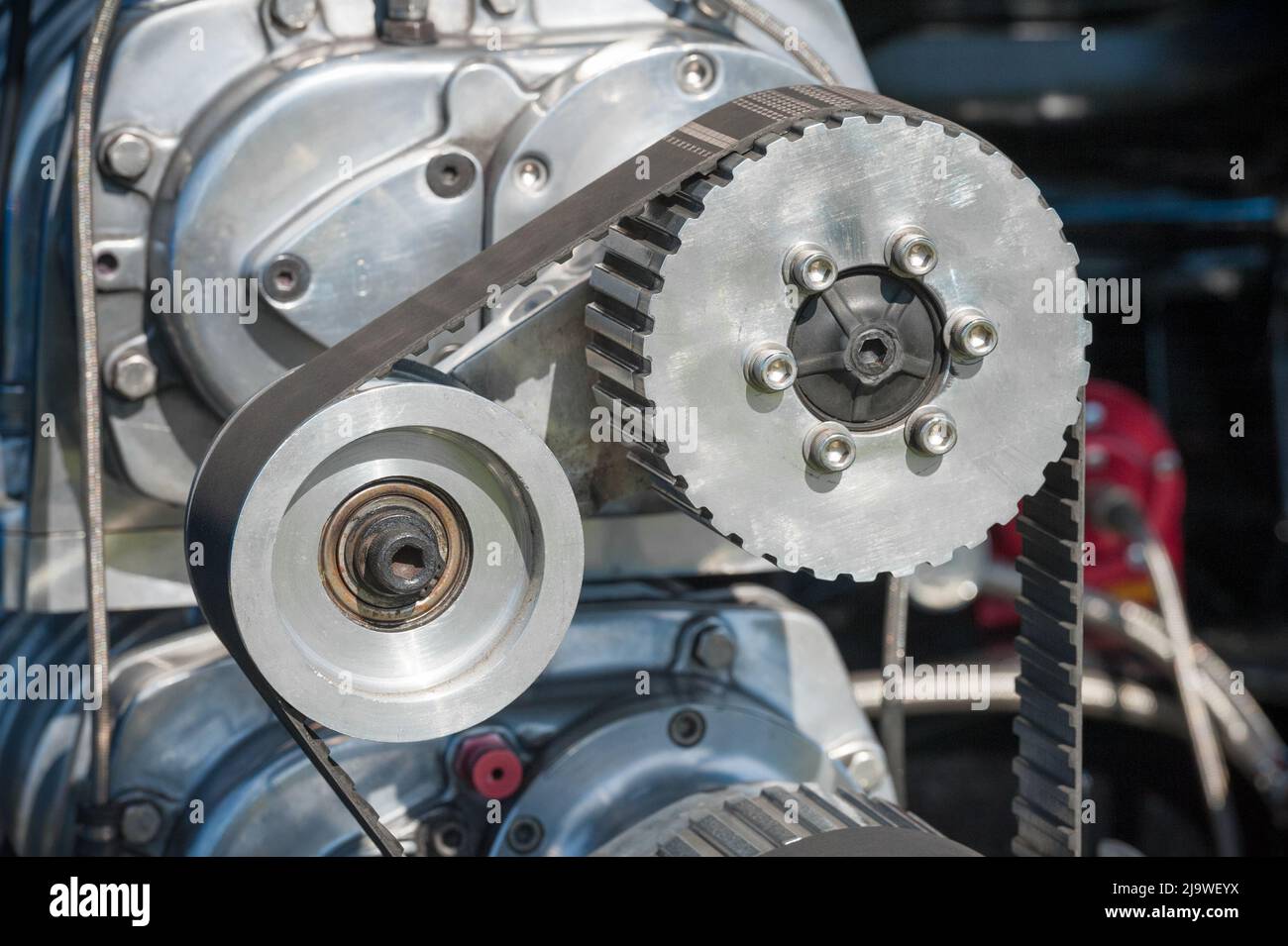 closeup of high performance automobile engine parts and drive belt Stock Photo