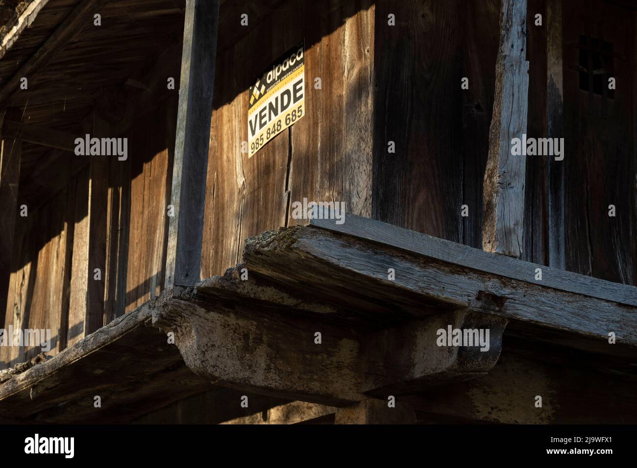 Derelict and abandoned farming granary for sale in a rural Spanish village, on 15th May 2022, in Mesta de Con, Picos Mountains, Asturias, Spain. Stock Photo