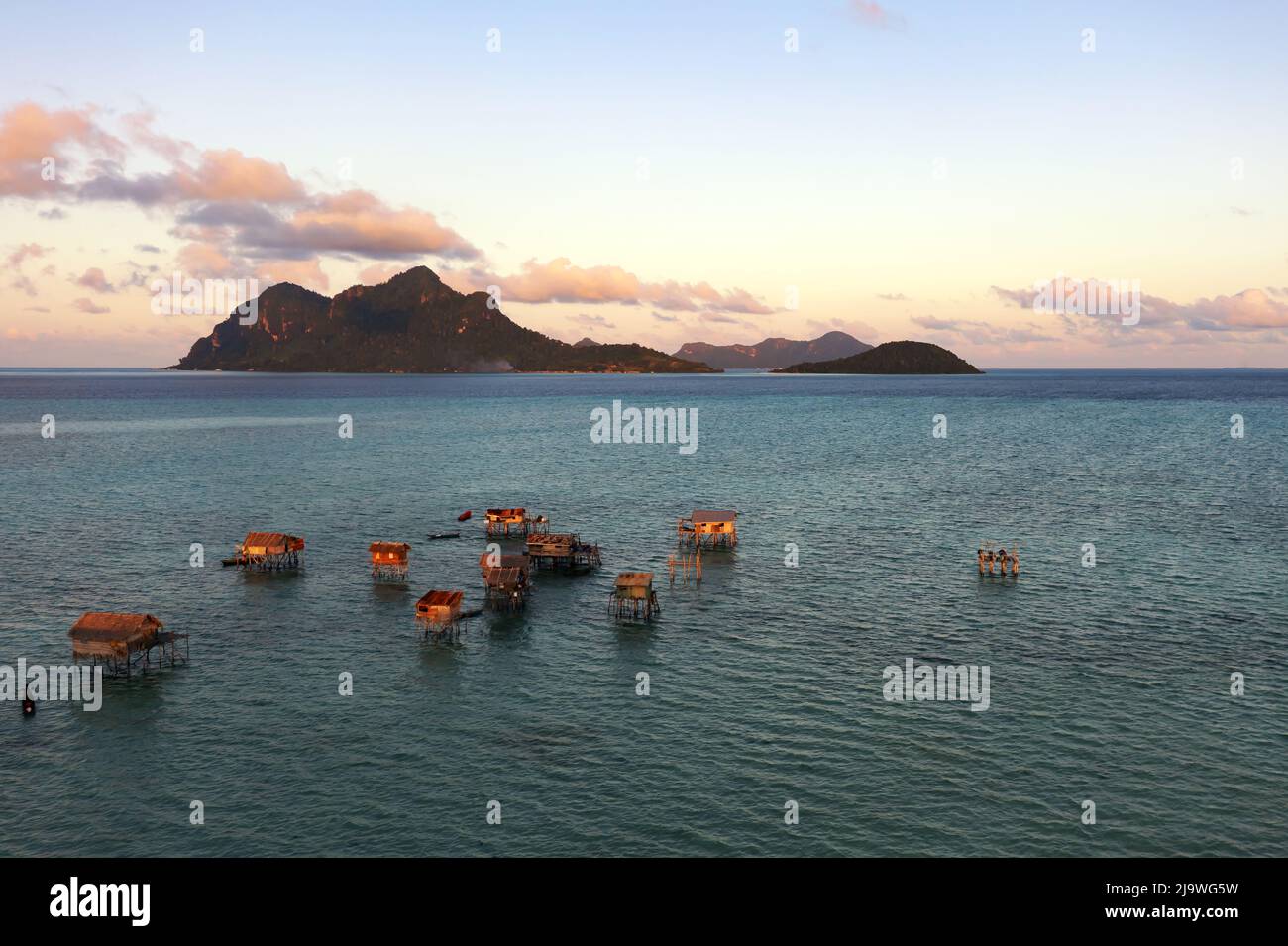 Sunset over tropical island new Maiga island near Bohey Dulang Stock Photo