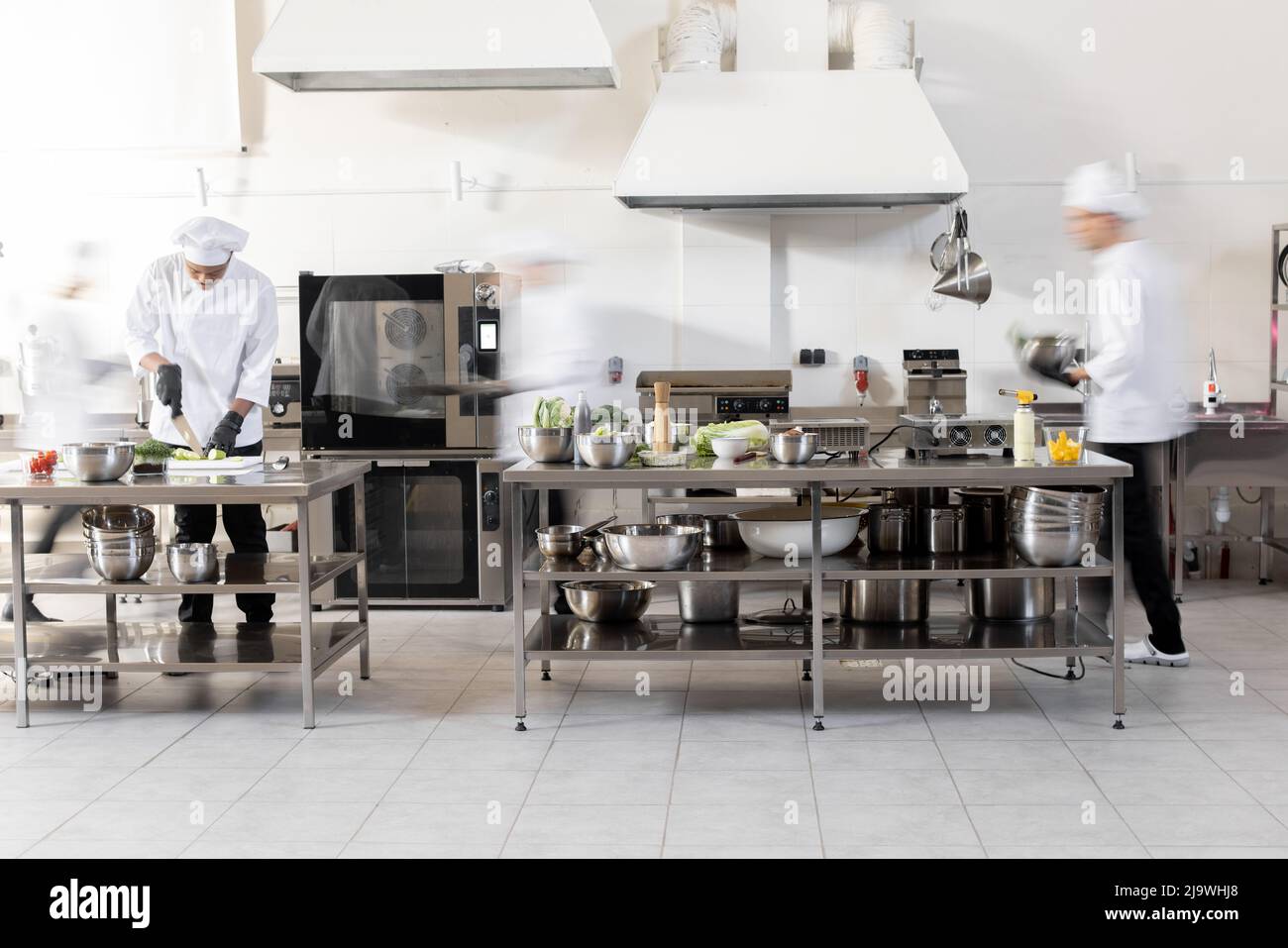 https://c8.alamy.com/comp/2J9WHJ8/chef-cooks-working-in-professional-kitchen-chefs-hurry-up-actively-cooking-meals-for-restaurant-long-exposure-with-motion-blurred-figures-2J9WHJ8.jpg