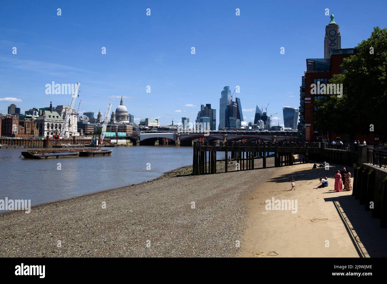 Beach on River Thames and City of London Stock Photo