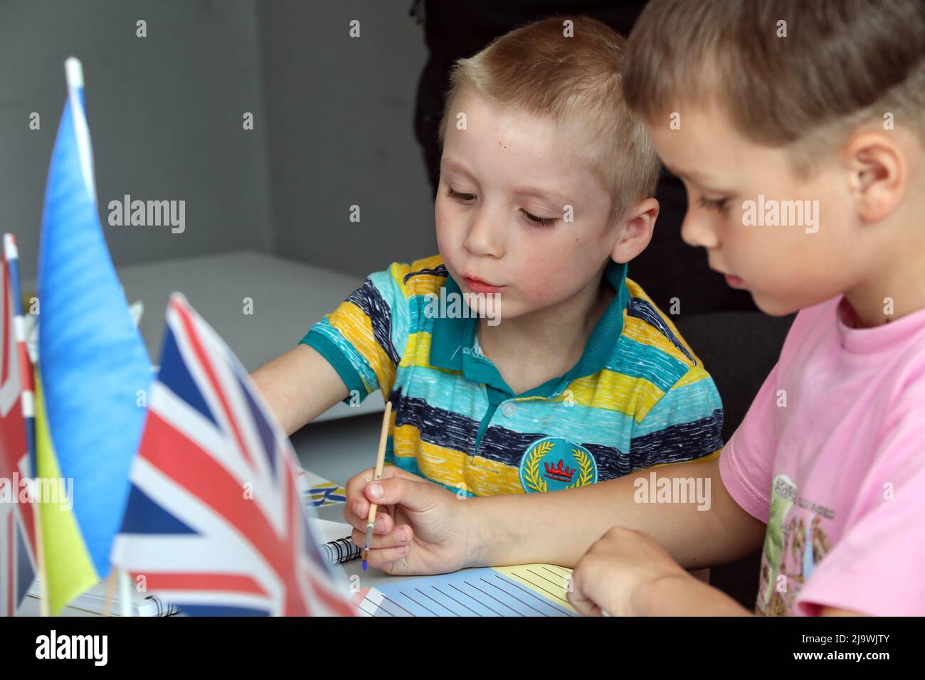ODESA, UKRAINE - MAY 25, 2022 - Children write their letters to UK Prime Minister Boris Johnson who has written an open letter to the children of Ukra Stock Photo