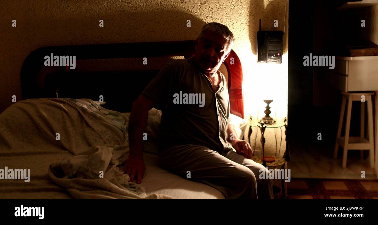 Old man bed dark hi-res stock photography and images - Alamy