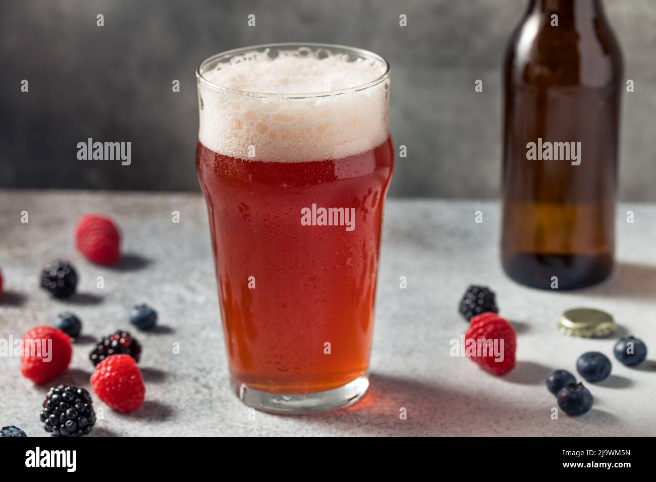 Cold Refreshing Berry Beer Shandy in a Pint Glass Stock Photo