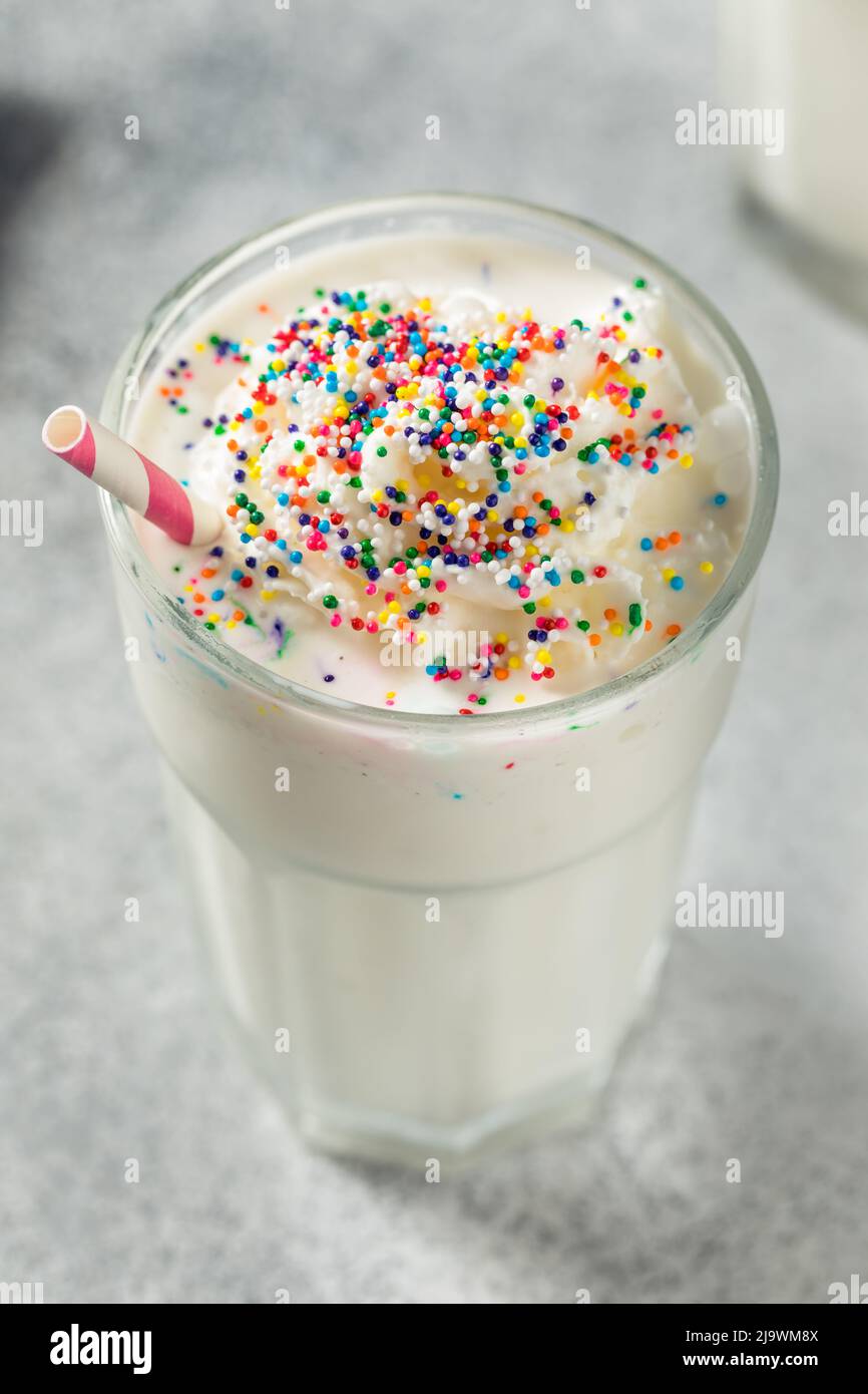 Cold Sweet Vanilla Milk Shake with Whipped Cream Stock Photo