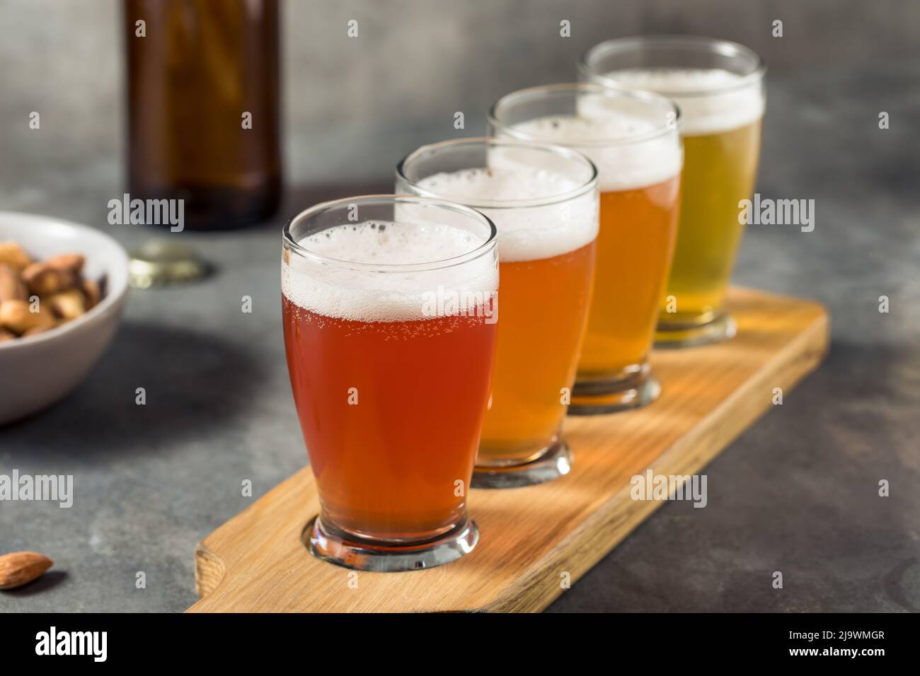 Cold Refreshing Sour Beer Flight with Cocktail Nuts Stock Photo