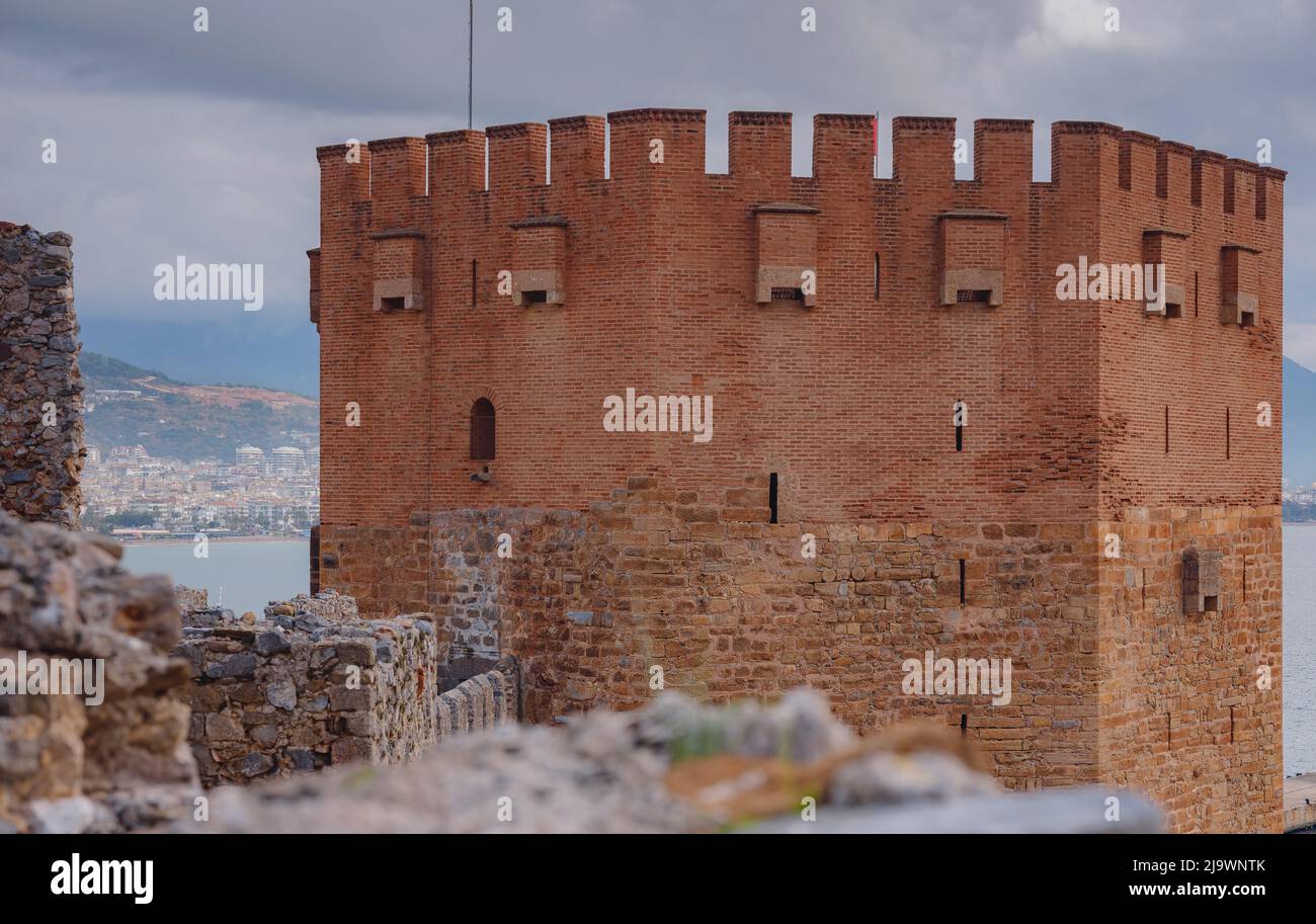 Alanya, turkey, winter walk by mediterranean sea. Kizil Kule tower on