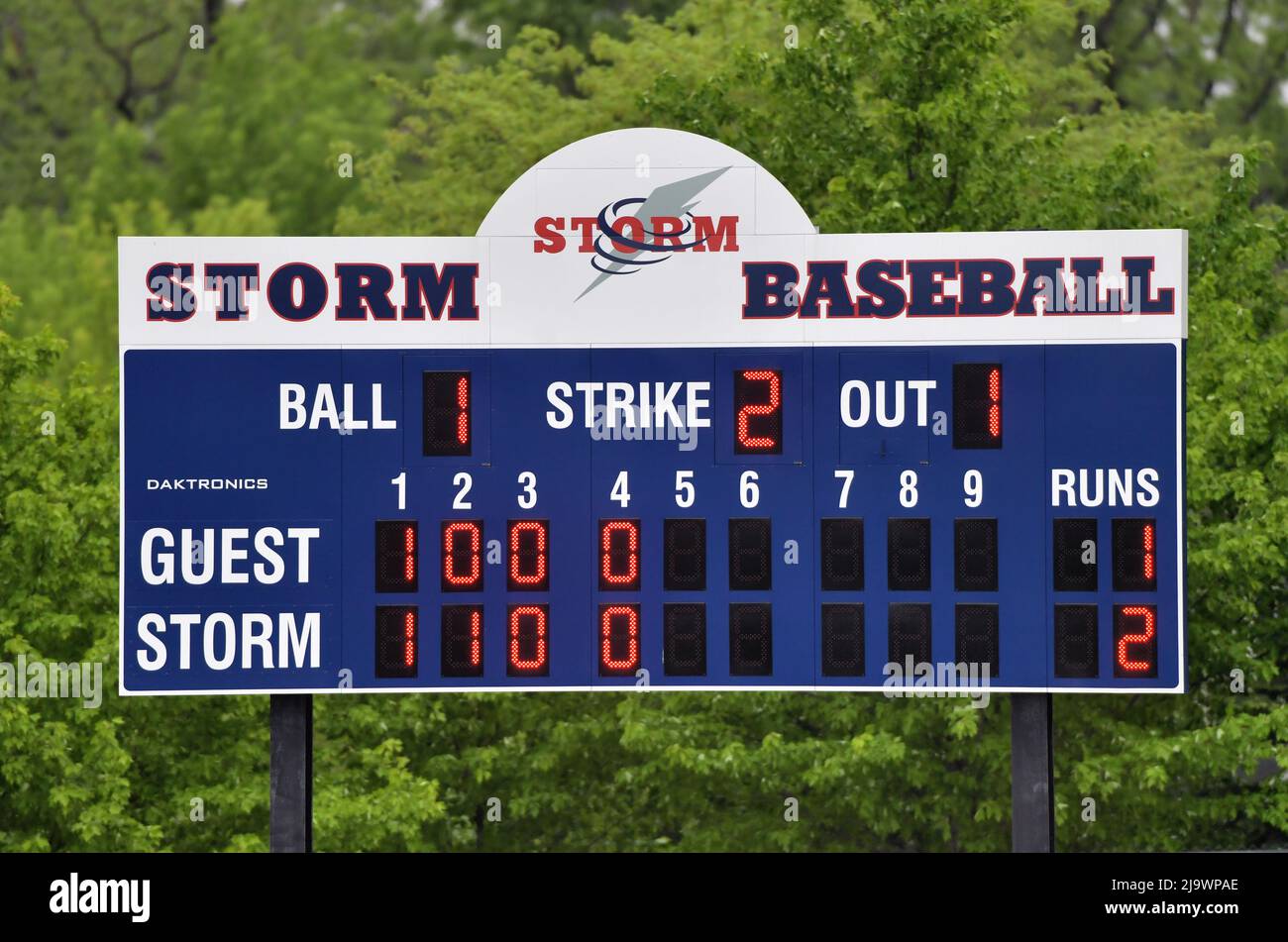 USA. A high school baseball scoreboard installed beyond the outfield fence. Stock Photo